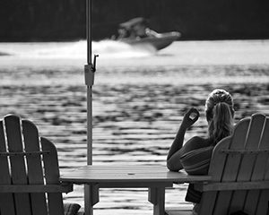 woman at peace sitting on lake